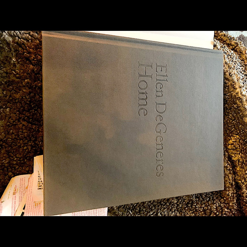 Coffee table book interior design .  Grey hard cover home designs